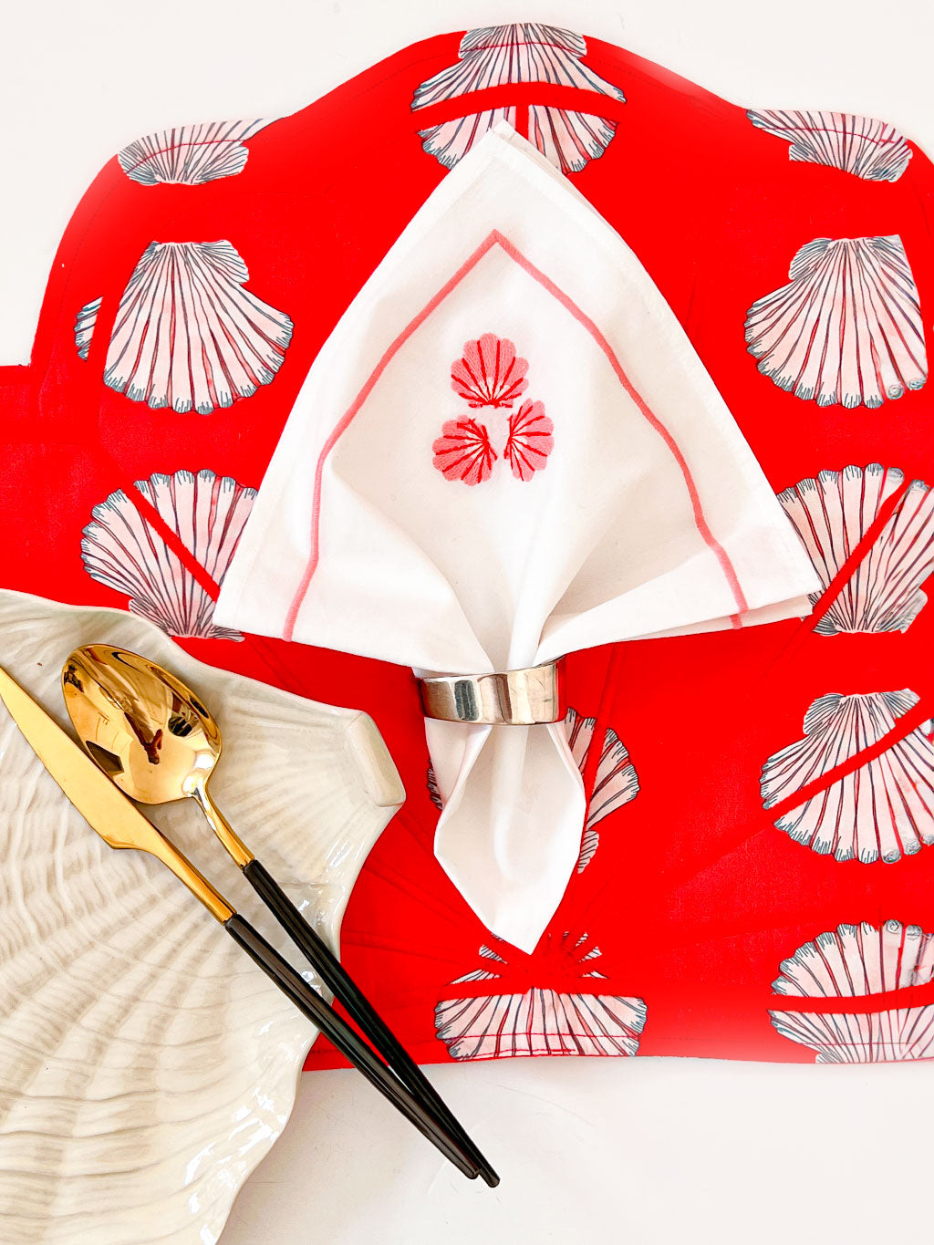 Sophisticated dining decor with red and white maritime accents