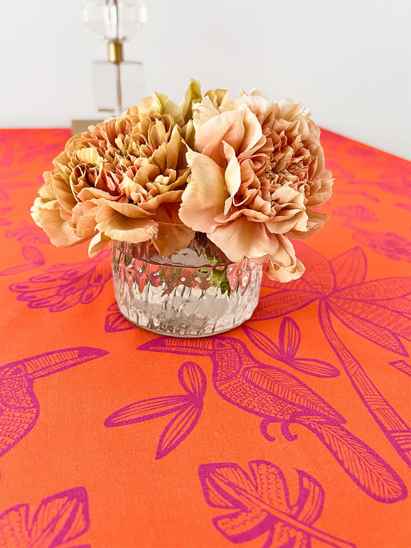 Detailed view of hand-printed tropical leaf motif on premium linen combined with carnation flowers