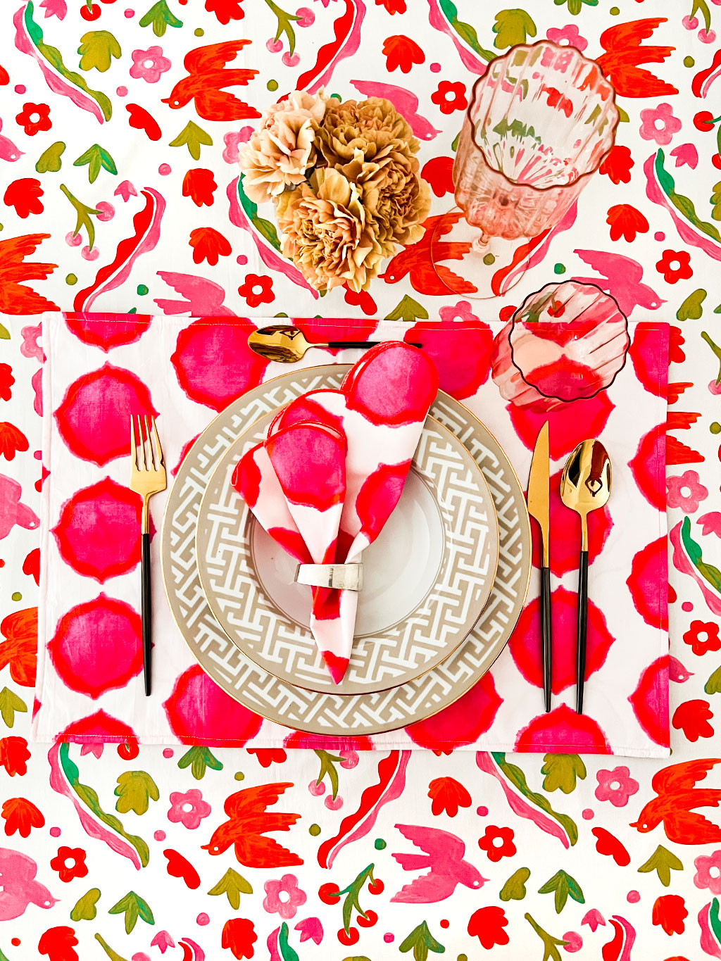 Sophisticated eclectic bohemian dining decor featuring a colorful folk-inspired print