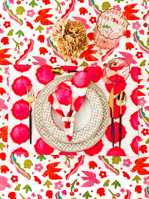 Sophisticated eclectic bohemian dining decor featuring a colorful folk-inspired print
