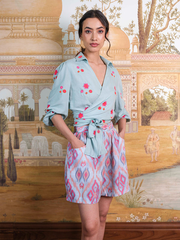 Close-up of the functional side-entry pockets and the natural linen texture on the Lilly Pilly resort shorts.