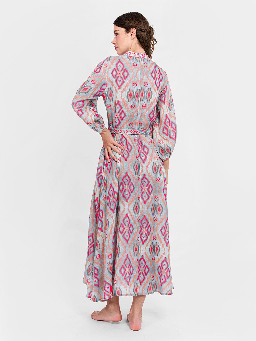 Rear view of the Marigold linen dress showcasing the effortless drape and the diamond ikat pattern.