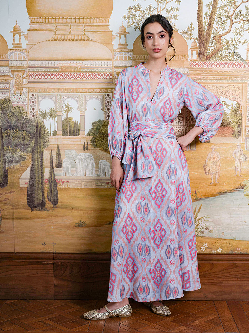 Model showcasing the comfortable, modest fit of the Marigold linen dress in a sophisticated setting.