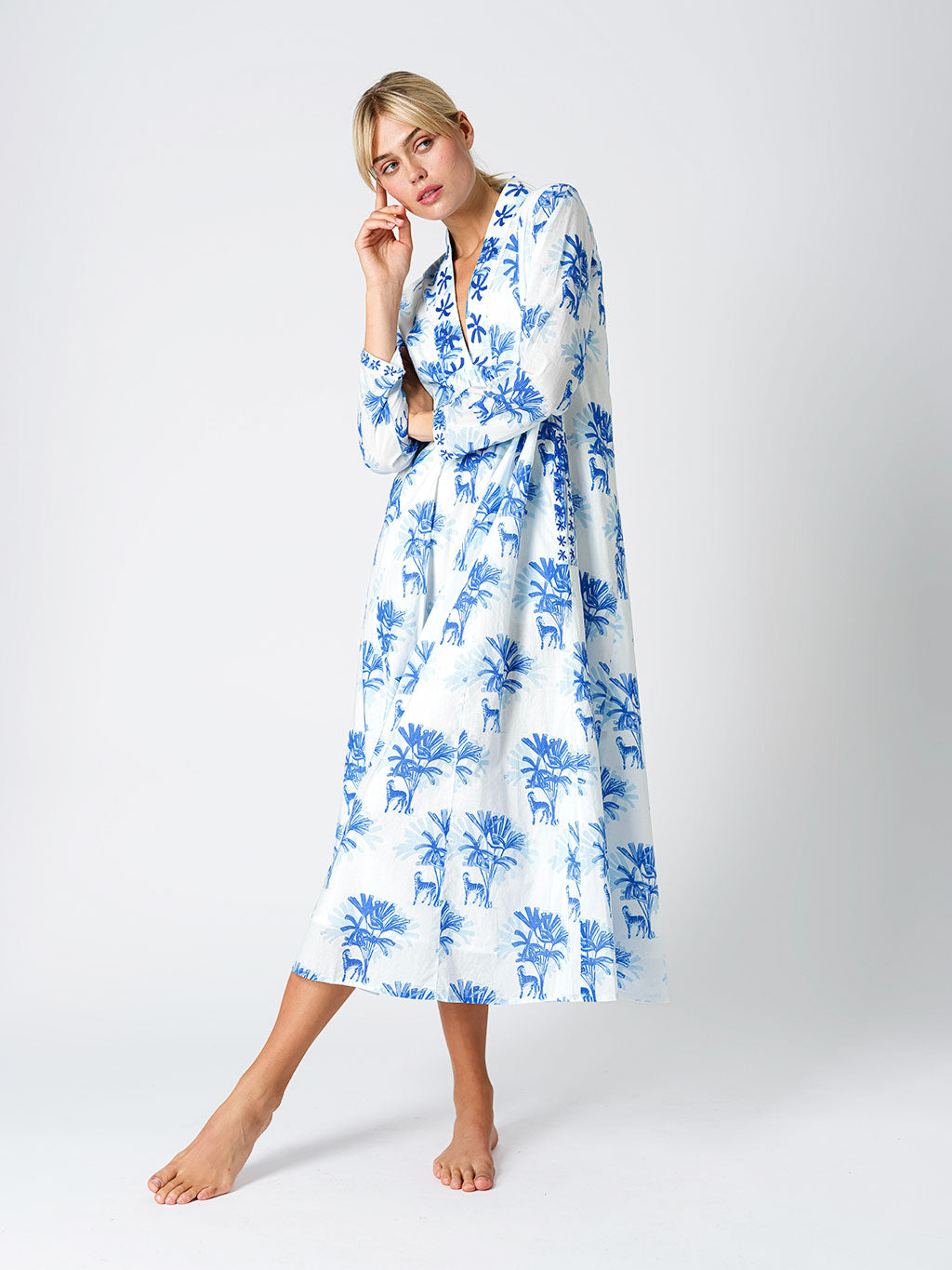 Model showcasing the effortless movement and breezy, sophisticated fit of the Sandalwood resort maxi dress.
