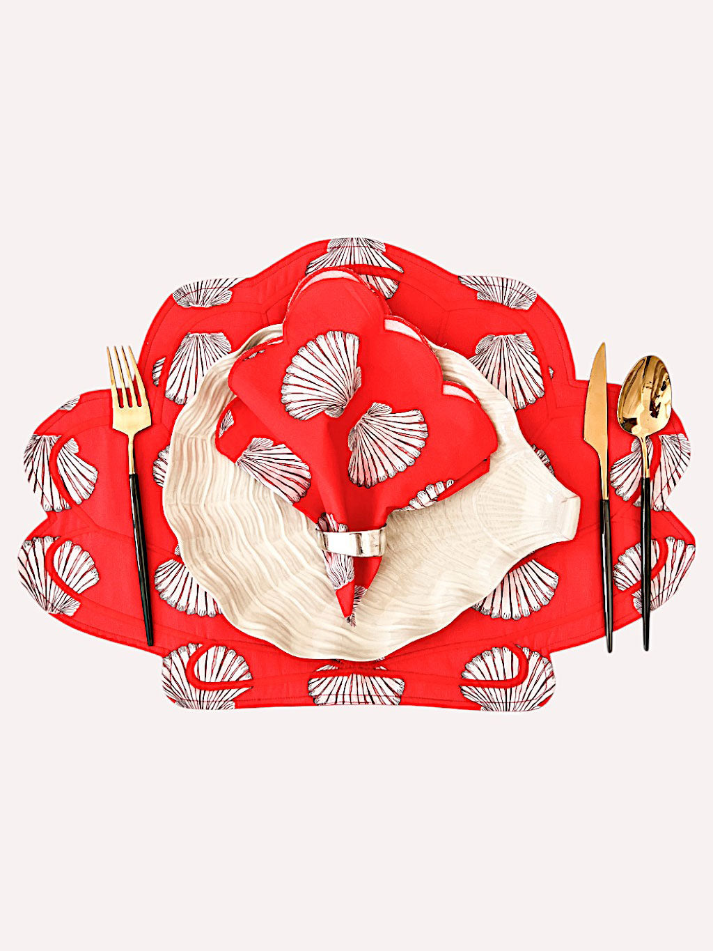 Artisanal shells on red textile design by Nimo With Love