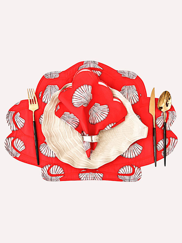 Artisanal shells on red textile design by Nimo With Love