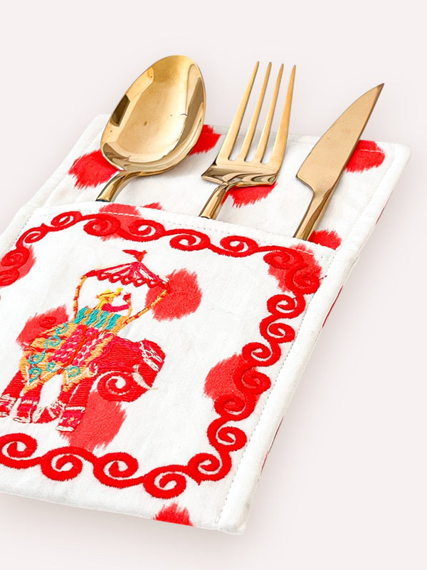 Luxury dining decor featuring traditional elephant motif embroidery
