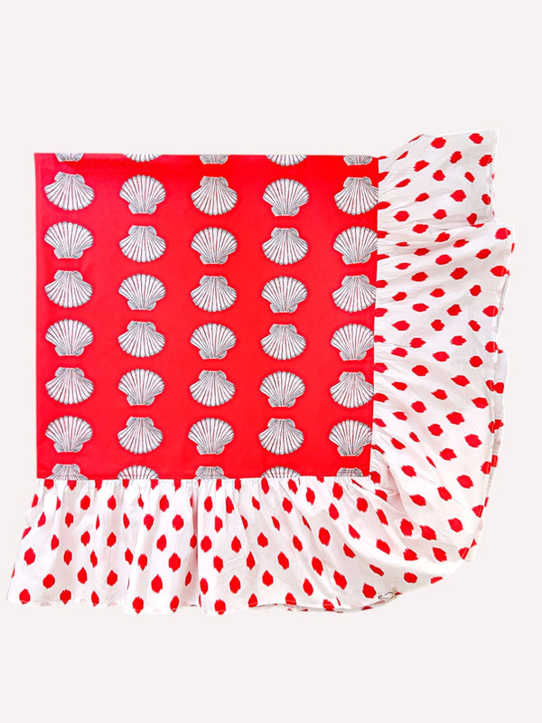 Close-up of the artisanal ruffle hem on premium organic cotton