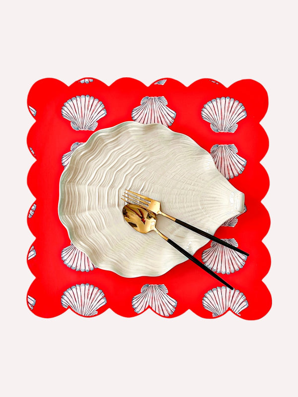 Shells on red organic cotton napkin with scalloped edges by Nimo With Lov