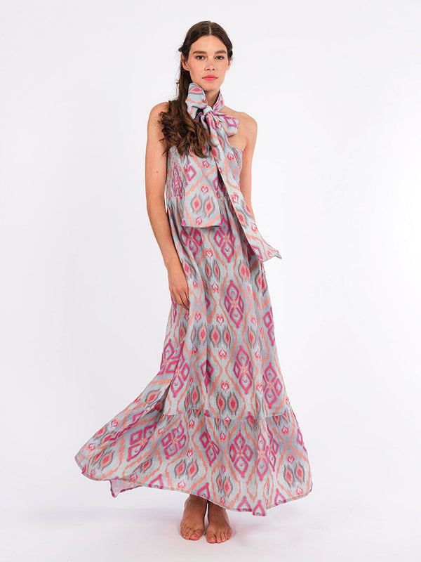 Model showcasing the breezy, elegant movement of the Caraway linen dress, perfect for a high-summer event.
