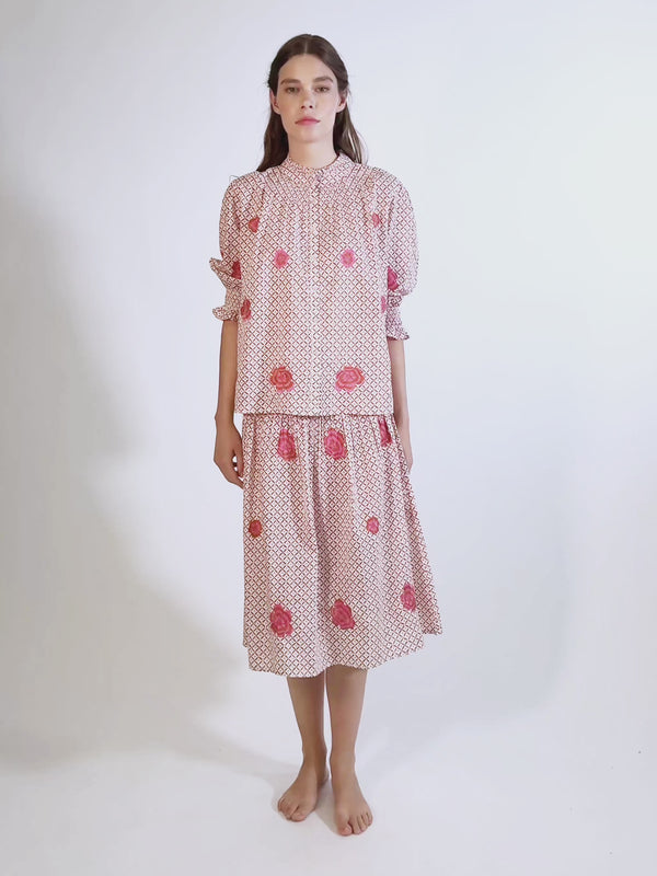 Video of the knee-length Lads Love skirt by Nimo With Love in mustard dot-ikat organic cotton with pink floral embroidery.