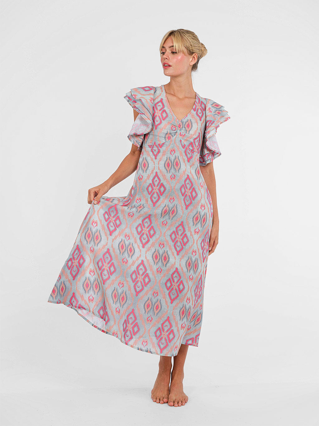 Midi-length Belladonna dress by Nimo With Love with statement ruffle sleeves crafted from natural linen.